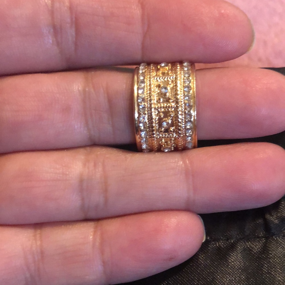 Beautiful simulated gold band ring with simulated diamonds.  Size 5.5